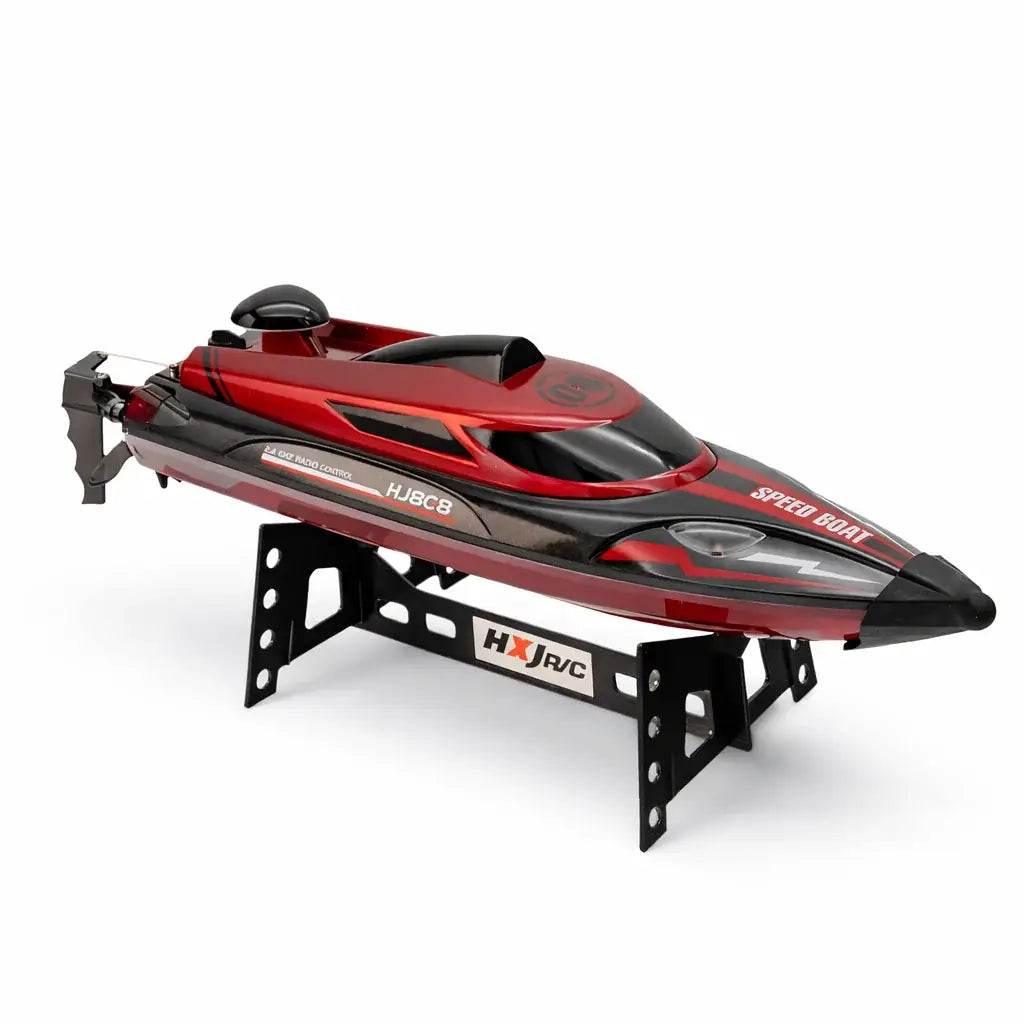 Rode en zwarte RC speedboot met afstandsbediening en originele doos